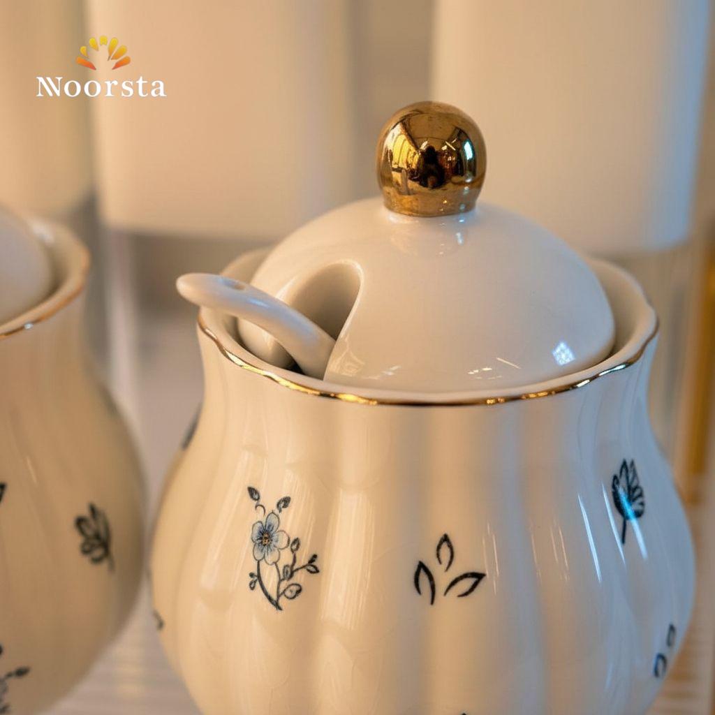 طقم توابل وزياتة بورسلين شيك لجهاز العروسة - Elegant Floral Porcelain & Glass Spice Rack Set with Acrylic Stand - Noorsta