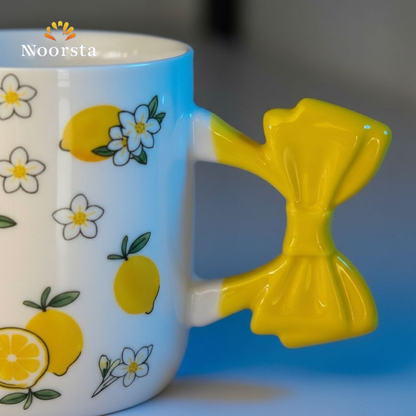 مج بورسلين شيك بنقشة الليمون ويد فيونكة صفراء - Chic Lemon Pattern Porcelain Mug with Yellow Bow Handle - Noorsta