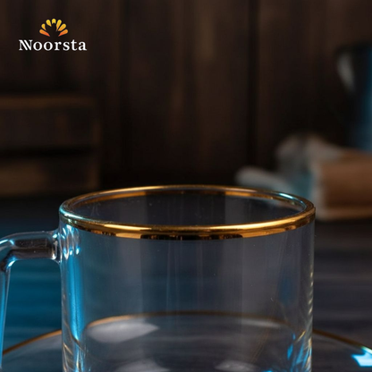 طقم مجات زجاج شفاف بحواف دهبي شيك للتقديم - Elegant clear glass mug and saucer set with gold rim - Noorsta