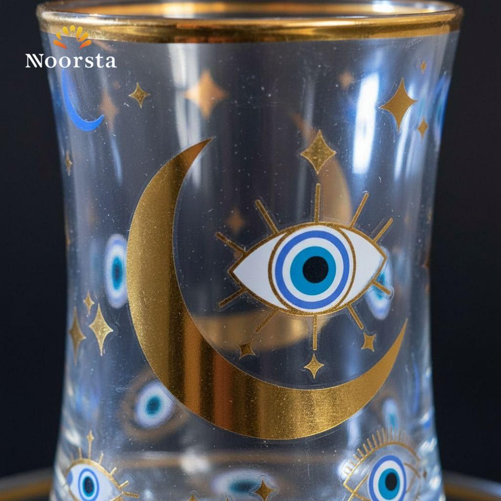 طقم استكانة شاي وطبق زجاجي فاخر بتصميم العين الزرقاء والهلال الذهبي - Celestial Evil Eye Glass Teacup & Saucer Set with Gold Accents - Noorsta